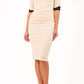 blonde model is wearing diva catwalk fellini sweetheart neckline fitted pencil dress with sleeves with cuff in colour beige with black contrasting detail front