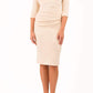 brinette model wearing diva catwalk kubrick pencil-skirt dress with sleeves and asymmetric neckline in beige front