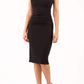 brunette model wearing diva catwalk zantana pencil-skirt dress with short laced sleeves and pleating across the tummy in black front