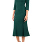 blonde model is wearing diva catwalk senne midaxi sleeved dress with fishtail and rounded neckline with a slit in the middle in forest green front