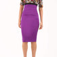 model wearing diva catwalk nadia fitted pencil dress made in the uk with short sleeves and pleated pencil skirt in purple and black front