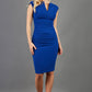 blonde model is wearing diva catwalk lydia pencil skirt dress in royal blue with pleating across the tummy without sleeves in royal blue front 