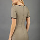 blonde model wearing seed albany contrasted pencil-skirt dress with short sleeves and pleating across the tummy with low square neckline and contrasted detail finishing in taupe brown back