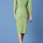 model is wearing diva catwalk seed fitzrovia sleeved pencil dress in citrus green back