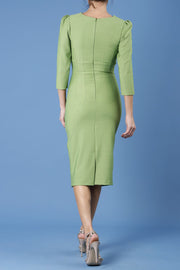 model is wearing diva catwalk seed fitzrovia sleeved pencil dress in citrus green back