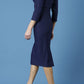model is wearing diva catwalk seed fitzrovia sleeved pencil dress in navy blue back