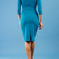 model is wearing diva catwalk donna sleeved pencil dress in mosaic blue back