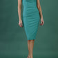 blonde model is wearing diva catwalk vivian sleeveless pencil skirt dress with overlapped bust area and lowered neckline in emerald green front