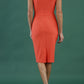 blonde model is wearing diva catwalk vivian sleeveless pencil skirt dress with overlapped bust area and lowered neckline in hot coral colour back