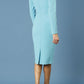 model is wearing diva catwalk cynthia long sleeve pencil dress with low v-neckline in celeste blue back