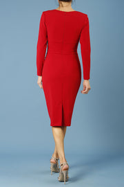 model is wearing diva catwalk cynthia long sleeve pencil dress with low v-neckline in scarlet red back