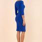 brunette model wearing diva catwalk natalie pencil-skirt dress with sleeves and v-neckline in royal blue back