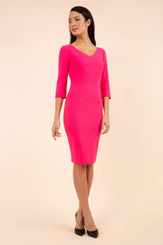 brunette model wearing diva catwalk natalie pencil-skirt dress with sleeves and v-neckline in pink front