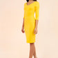 brunette model wearing diva catwalk natalie pencil-skirt dress with sleeves and v-neckline in yellow front