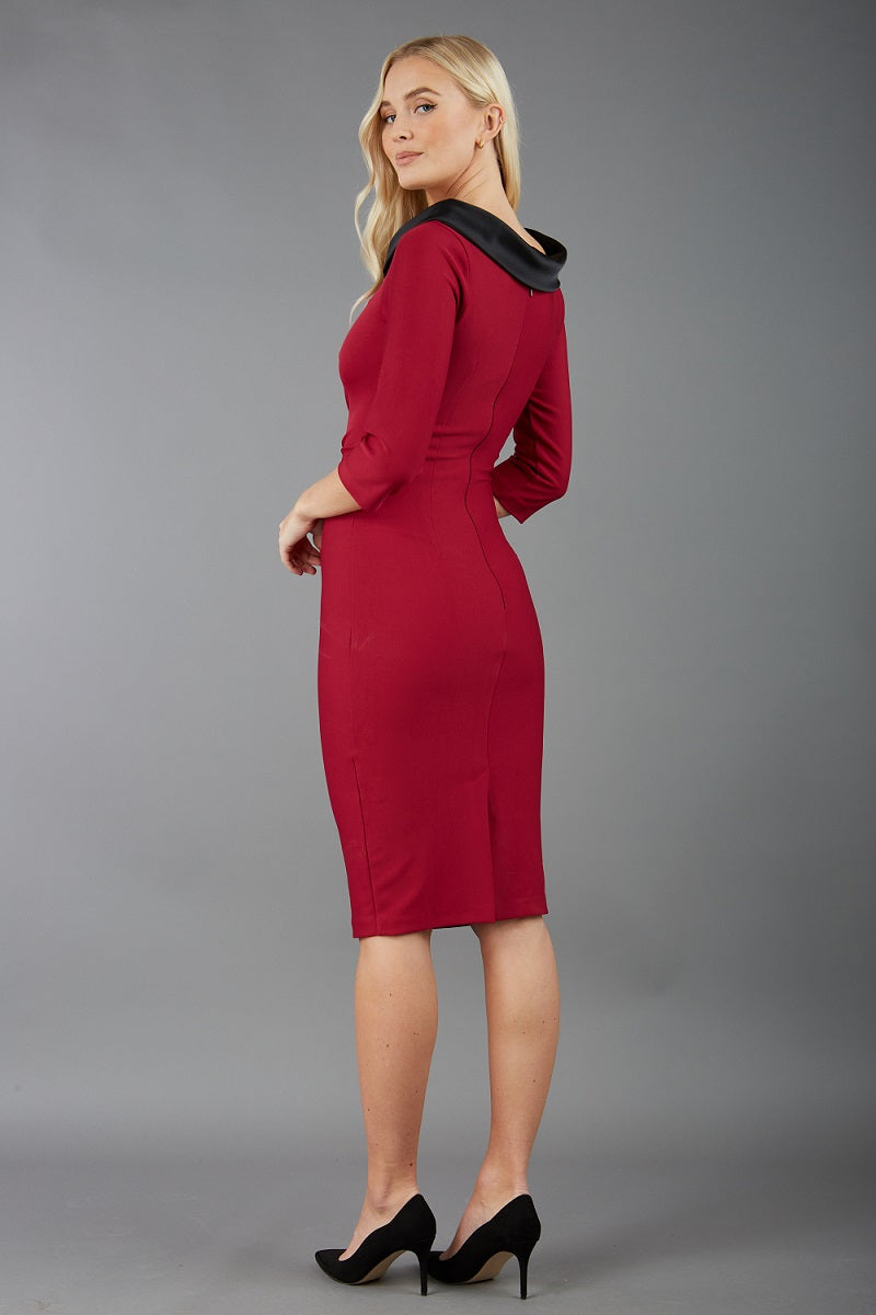 model is wearing diva catwalk pencil dress with contrasting asymmetric satin neckline in beet red back