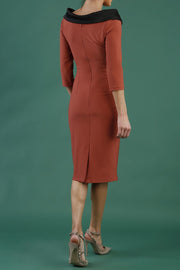 model is wearing diva catwalk pencil dress with contrasting asymmetric satin neckline in marsala brown back