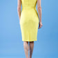 model wearing diva catwalk daphne sleeveless blazing yellow pencil dress with rounded neckline with split in the middle in back
