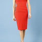 model wearing diva catwalk daphne sleeveless burn orange pencil dress with rounded neckline with split in the middle in front