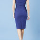 model wearing diva catwalk daphne sleeveless navy blue pencil dress with rounded neckline with split in the middle in front back
