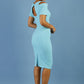 model wearing diva catwalk ruth pencil skirt dress with a keyhole cut in rounded neckline and cold shoulder detail in celeste blue colour side