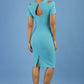 model wearing diva catwalk ruth pencil skirt dress with a keyhole cut in rounded neckline and cold shoulder detail in jade green colour back