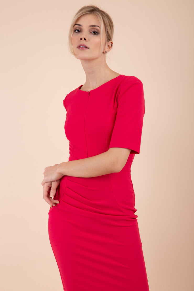 Model wearing the Diva Melbourne dress in pencil dress design in honeysuckle pink front image