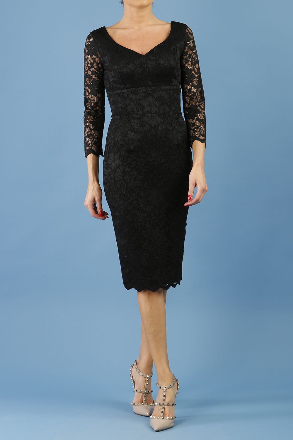 model is wearing diva catwalk bucklebury lace dress with sleeved and low neckline in black front