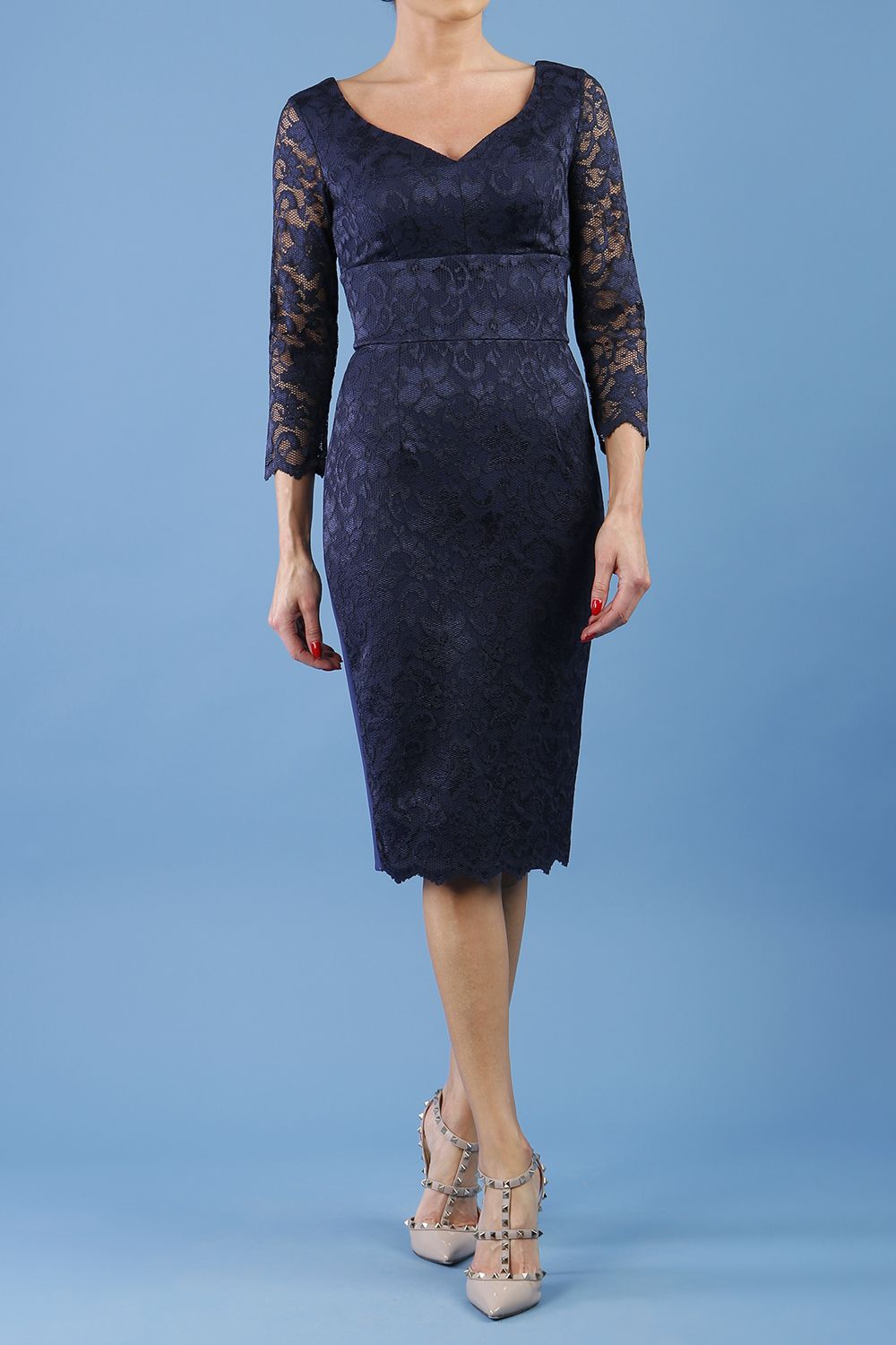 model is wearing diva catwalk bucklebury lace dress with sleeved and low neckline in navy blue front