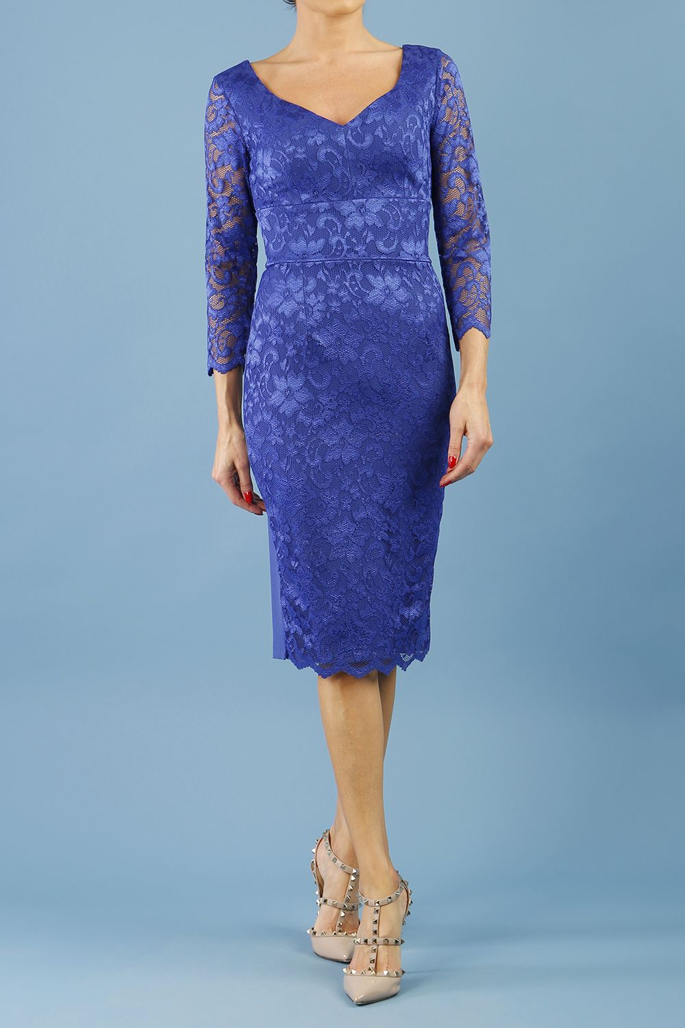model is wearing diva catwalk bucklebury lace dress with sleeved and low neckline in riviera blue front