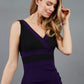 model is wearing duva catwalk banbury sleeveless colour block pencil dress with low v-neck in crown jewel and black front