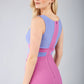 model is wearing duva catwalk banbury sleeveless colour block pencil dress with low v-neck in rosebud pink and vista blue back