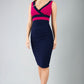 model is wearing duva catwalk banbury sleeveless colour block pencil dress with low v-neck in navy and magenta haze front