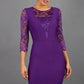 Brunetter Model is wearing seed couture lace pencil dress by diva catwalk in purple front