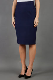 blonde model is wearing seed diva dawlish navy pencil skirt front