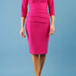 Model wearing the Diva Daphne ¾ Sleeved dress with pleat detail across the hips and ¾ sleeve length in magenta haze front