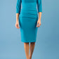 Model wearing the Diva Daphne ¾ Sleeved dress with pleat detail across the hips and ¾ sleeve length in mosaic blue front