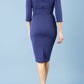Model wearing the Diva Daphne ¾ Sleeved dress with pleat detail across the hips and ¾ sleeve length in navy back