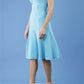 model is wearing diva catwalk madison a-line dress with square neckline and short sleeve in celestial blue front