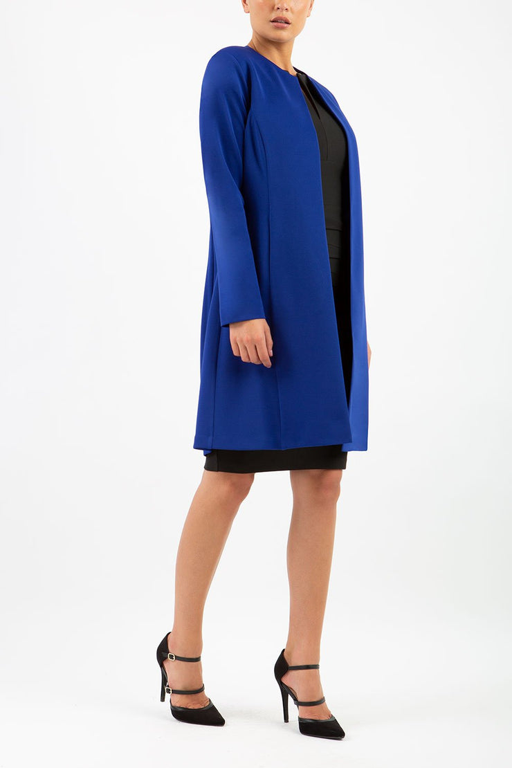 model wearing diva catwalk royal blue coat with long sleeves and a belt front