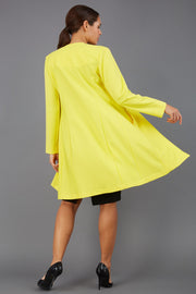 model wearing diva catwalk yellow coat with long sleeves and a belt front