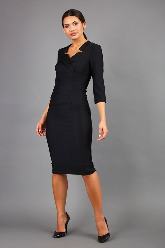 Brunette wearing seed pencil black dress front image