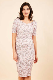 Model wearing the Diva Paradise Tudor Vine dress in pencil dress design in tudor vine print front image
