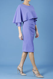 model wearing diva catwalk lizanne pencil-skirt dress with an attached wide cape detail and 3 4 sleeves in colour fusion indigo front