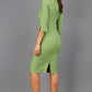 Brunette model is wearing couture stretch seed pencil bell 3/4 sleeve pencil dress by diva catwalk in citrus green back image