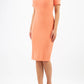 model wearing diva catwalk mitzi short sleeve pencil dress with square frilled neckline in dusty coral front 
