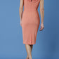 brunette model is wearing diva catwalk odessa pencil sleeveless dress with frill detail on rounded neckline in dusty coral back