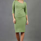 blonde model is wearing diva catwalk pencil skirt in aspen green paired with courtney sleeved top front