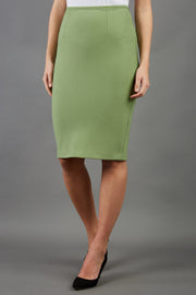 blonde model is wearing diva catwalk pencil skirt in aspen green front