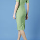 model is wearing diva catwalk seed barton short sleeve pencil dress with v-neck in citrus green back