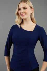 blonde model is wearing diva catwalk courtney sleeved top in colour navy front paired with black skirt